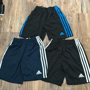 Bulk set of 4 pairs of Adidas Boys Shorts. Size small and in great condition.